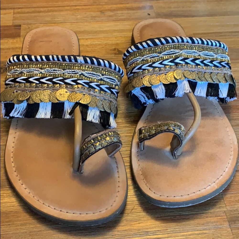 Gold embellishes summer sandals.